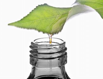 bottle with homeopathy balm and leaf